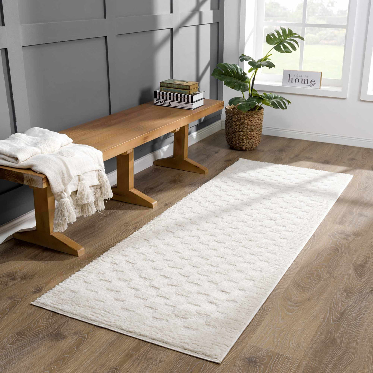 Leryn Ivory Checkered Area Rug by Boutique Rugs in a cozy living room setting with furniture and decor.