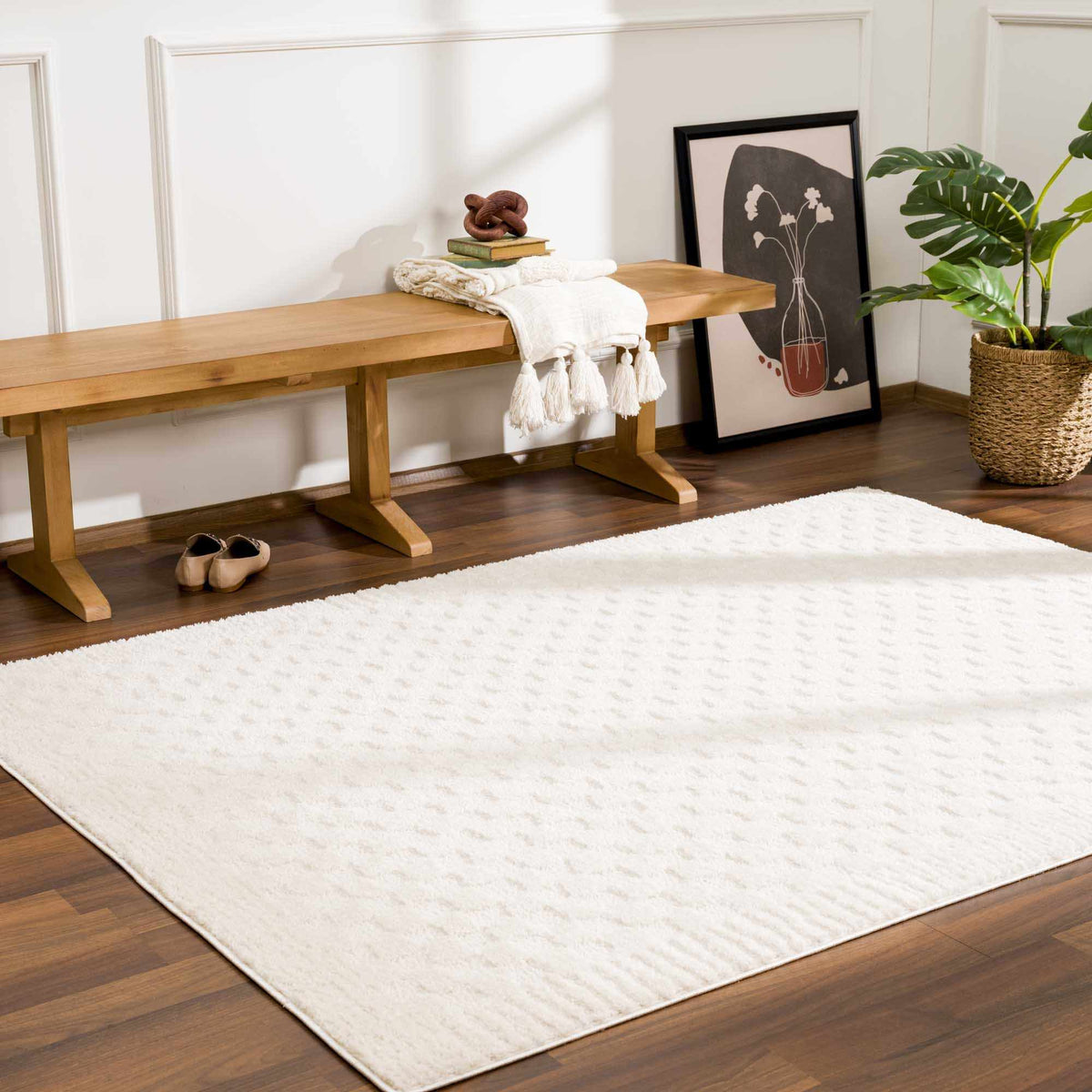 Leryn Ivory Checkered Area Rug by Boutique Rugs laid out in a living room setting, showcasing its soft checkered pattern and neutral tones.