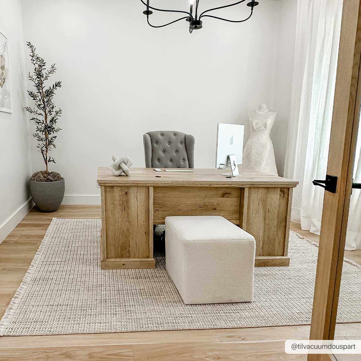 Cream Gowan area rug by Boutique Rugs, 6x9 feet, showing a plush, soft texture and intricate pattern in a cozy living space.
