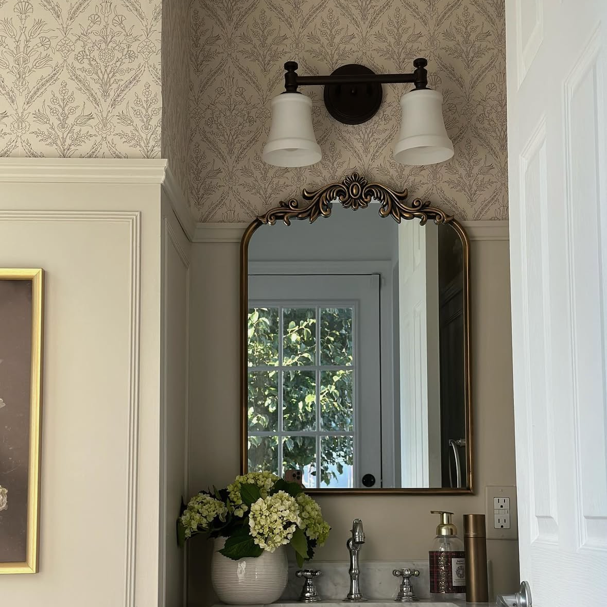 Decorative Gretta Floral wallpaper by North and Finch featuring vibrant floral patterns on a neutral background.