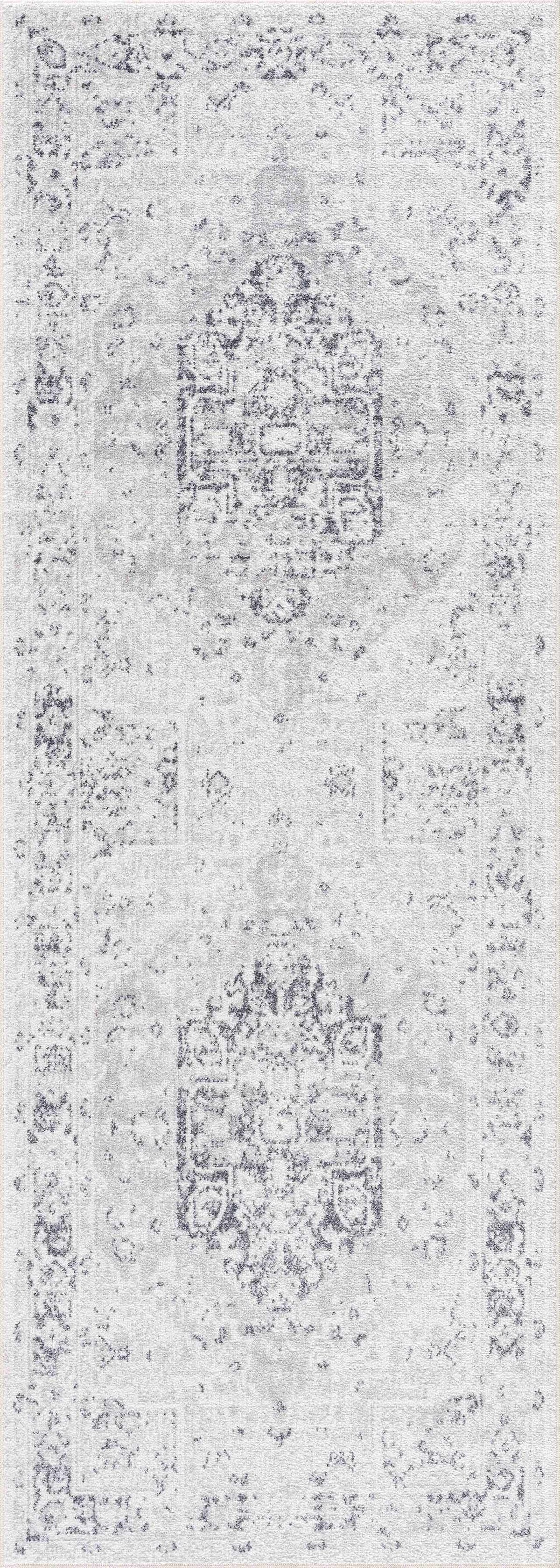 An anthracite flat pile washable rug from Boutique Rugs with a modern, textured design, shown in a neutral room setting.