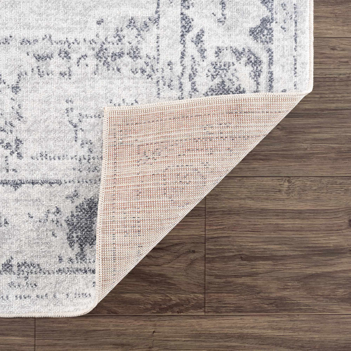 Folded Akram Antrasit flat pile washable rug by Boutique Rugs, showing its soft dark gray texture and durable design.