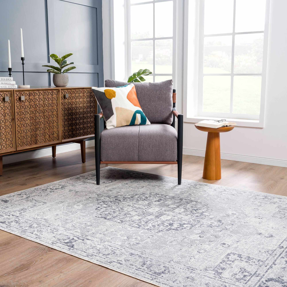 Akram Antrasit flat pile washable rug from Boutique Rugs in a cozy living room setting with neutral tones and modern decor.