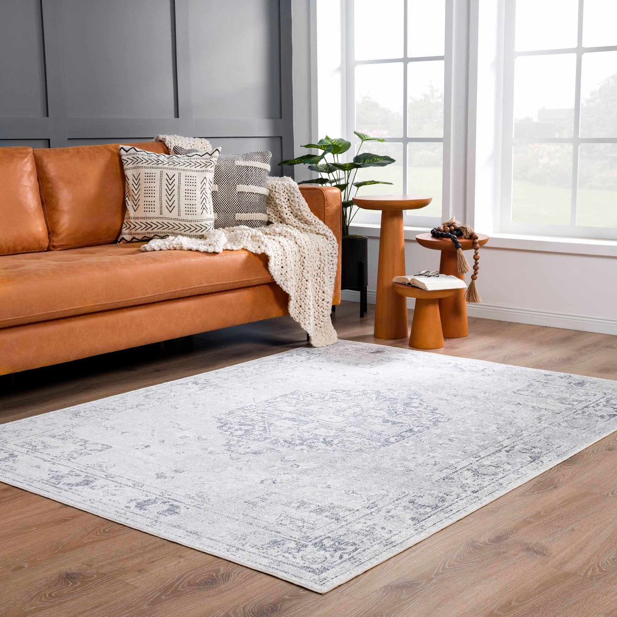 An Akram Antrasit flat pile washable rug by Boutique Rugs displayed in a modern living room setting.