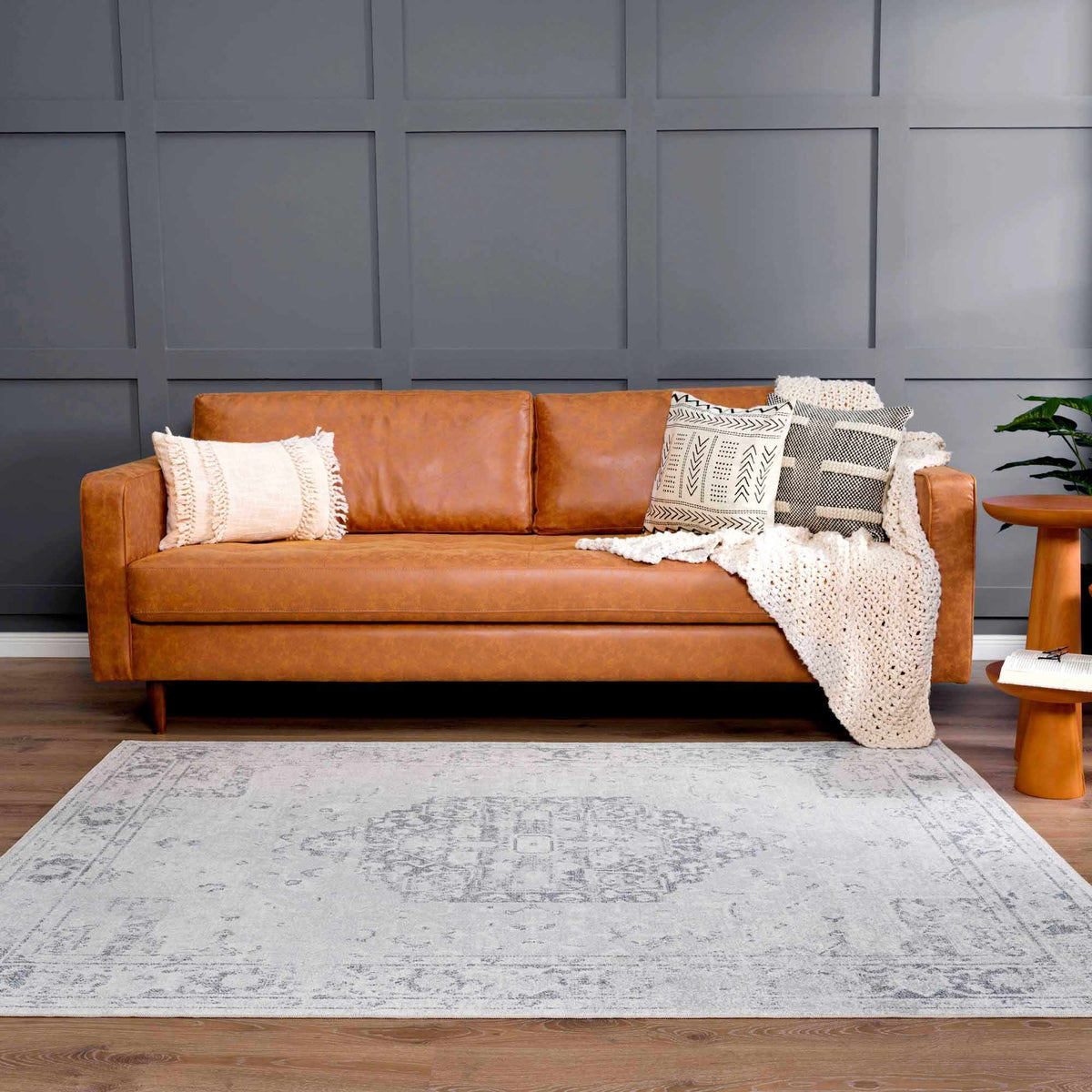 An anthracite flat pile washable rug from Boutique Rugs displayed in a modern living room setting.