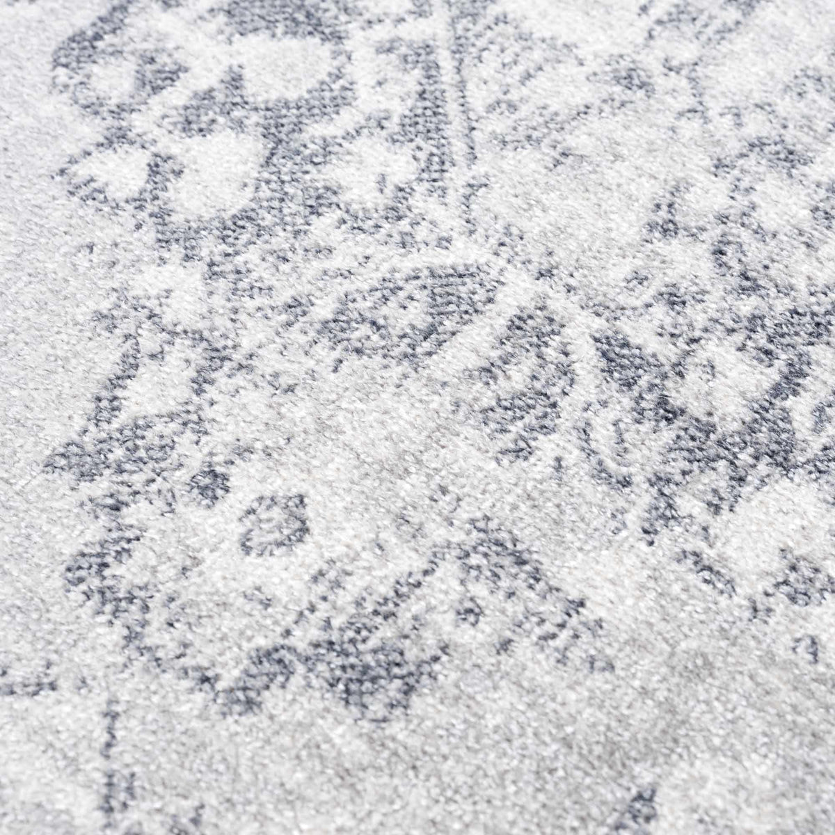 An ash gray flat pile washable rug from Boutique Rugs, showcasing a soft, textured surface in a modern design.