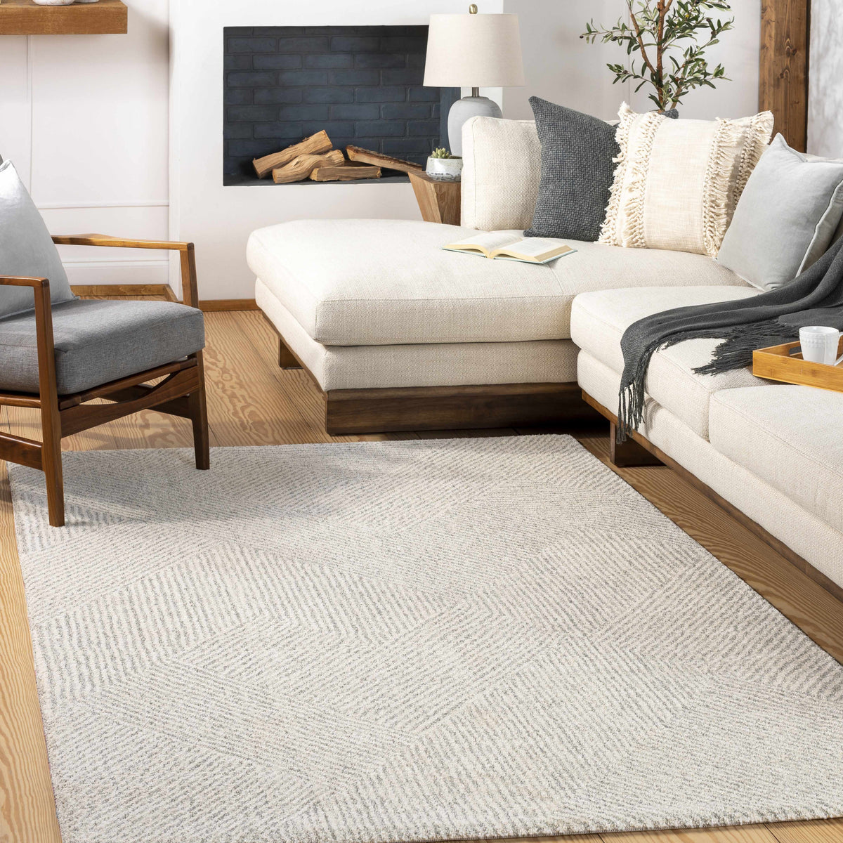 Horsley Area Rug by Boutique Rugs shown in a cozy living room setting, with a modern geometric pattern and soft neutral colors.