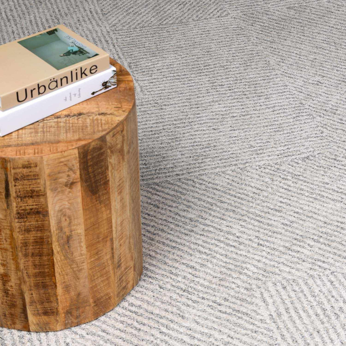 Horsley Boutique Rugs area rug with intricate patterns in neutral tones, displayed on a hardwood floor.