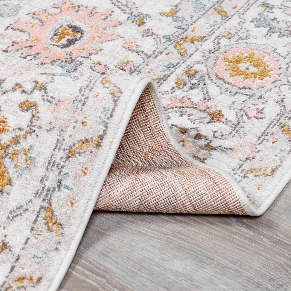 Folded Herstmonceux area rug by Boutique Rugs, showcasing a textured, patterned design in neutral tones.