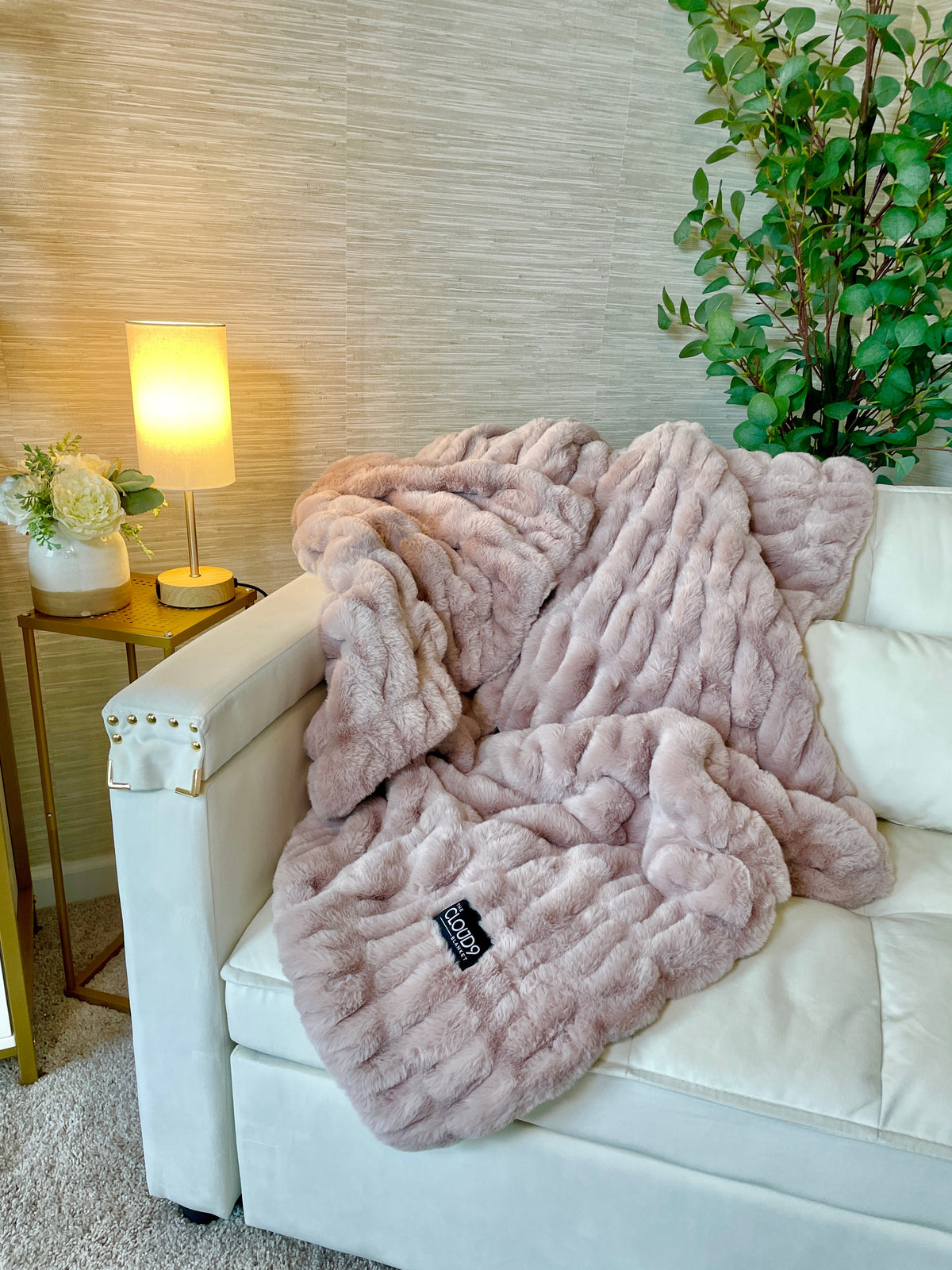 Medium blush faux fur blanket by Cloud9, showing soft, plush texture and cozy appearance on a neutral background.