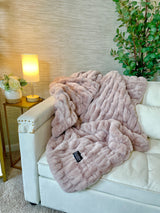 Medium blush faux fur blanket by Cloud9, showing soft, plush texture and cozy appearance on a neutral background.