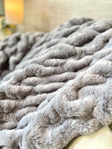 Medium gray faux fur blanket from Cloud9, 50x60 inches, soft and plush with a luxurious textured surface.