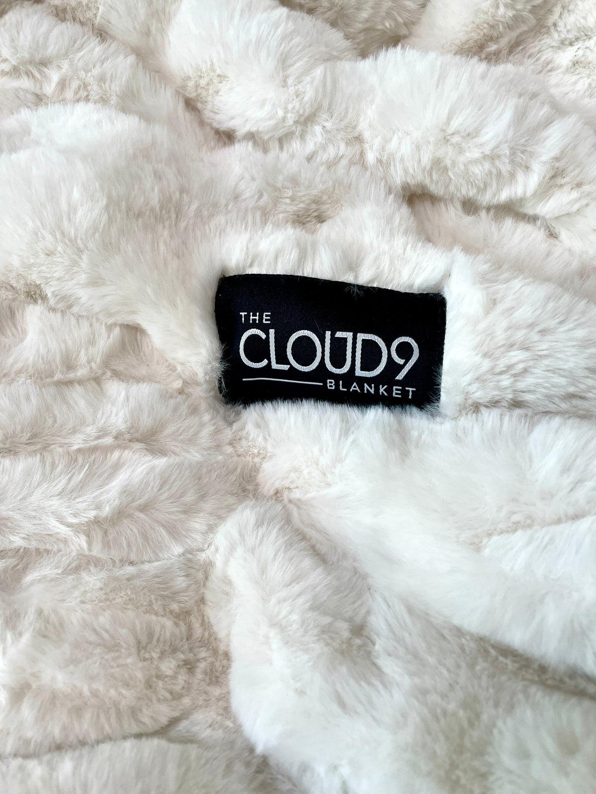 Ivory faux fur blanket by Cloud9, lap size 30x40 inches, soft plush texture perfect for cozy comfort.