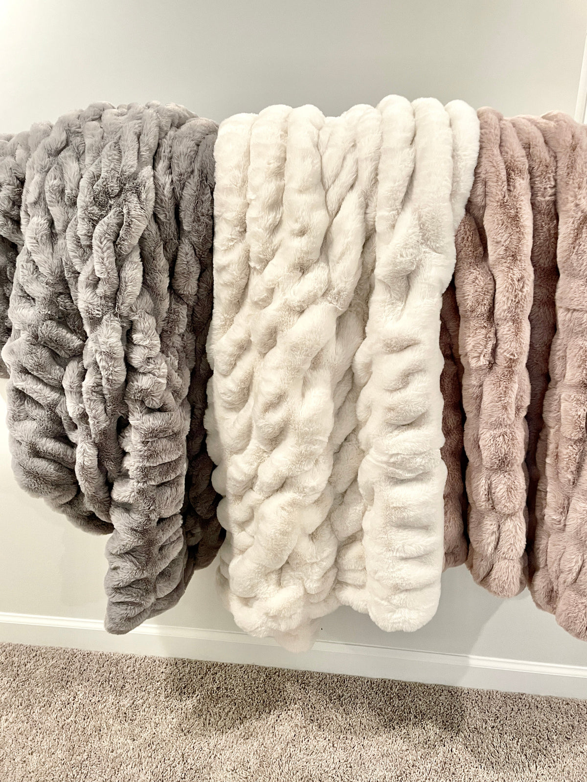 Soft Cloud9 faux fur blanket in medium and large sizes, featuring plush texture and cozy design for comfortable home decor.