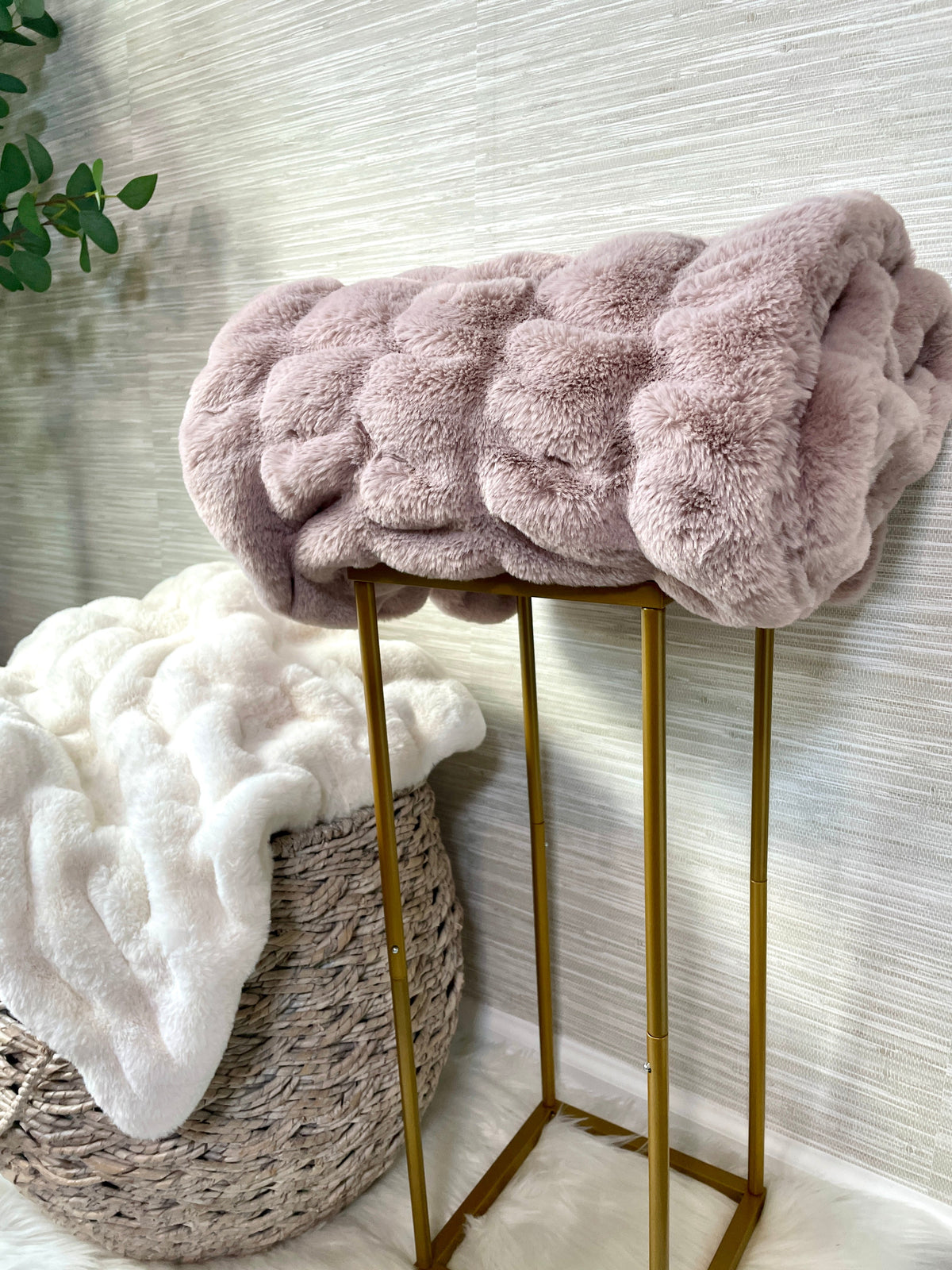 Soft blush faux fur blanket with a 30x40 inch lap size from Cloud9, shown draped and plush in the image.