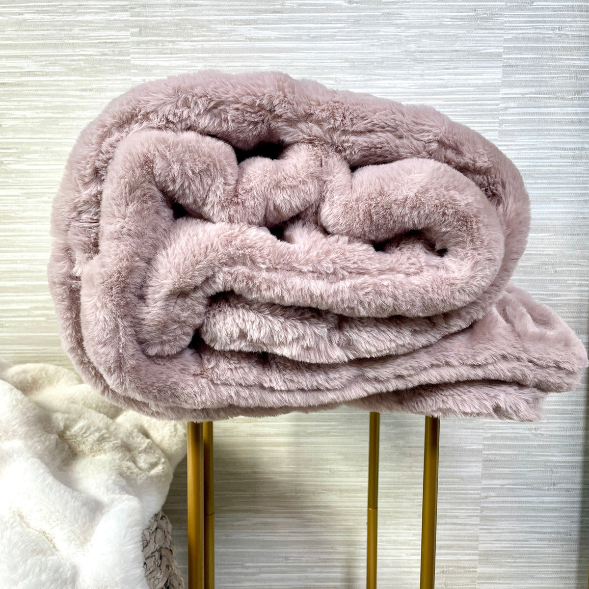 Soft blush faux fur blanket by Cloud9, 30x40 inch lap-sized throw with plush, cozy texture perfect for lounging.