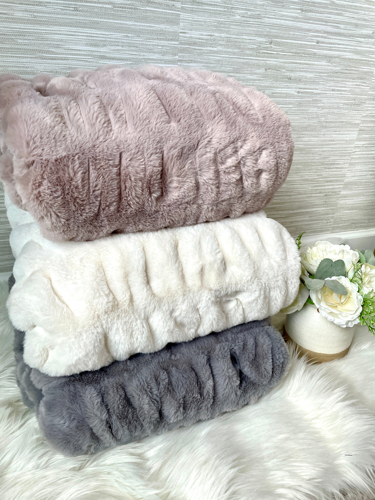 Gray faux fur blanket by Cloud9, 30x40 inch lap size, soft textured fabric shown draped on a surface.