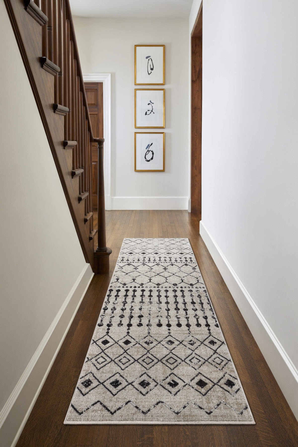 Joppatowne washable area rug by Boutique Rugs, beige and blue runner in a cozy living room setting.