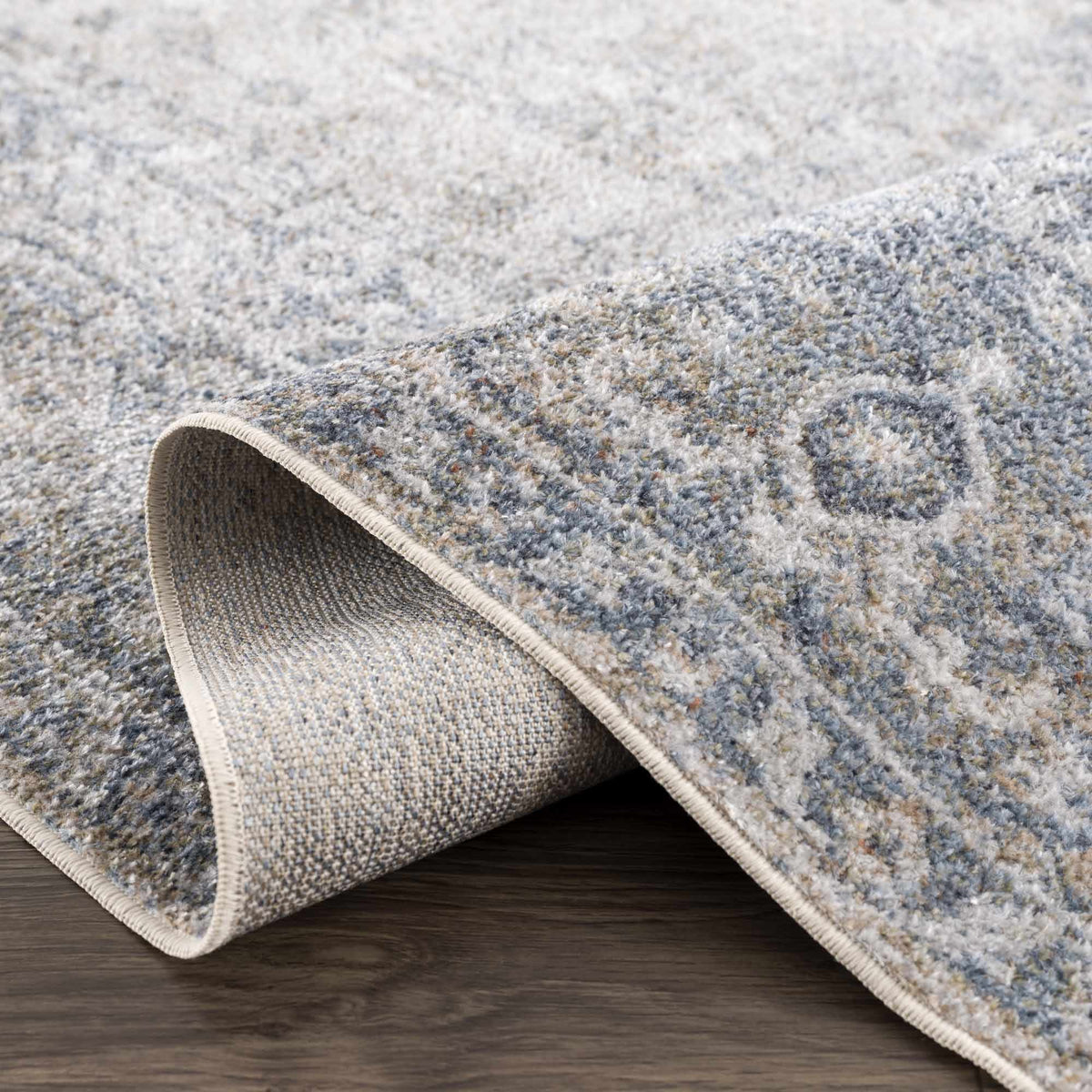 Blue Boutique Rugs Gael washable rug with fold, showcasing soft fabric and stylish design suitable for modern interiors.