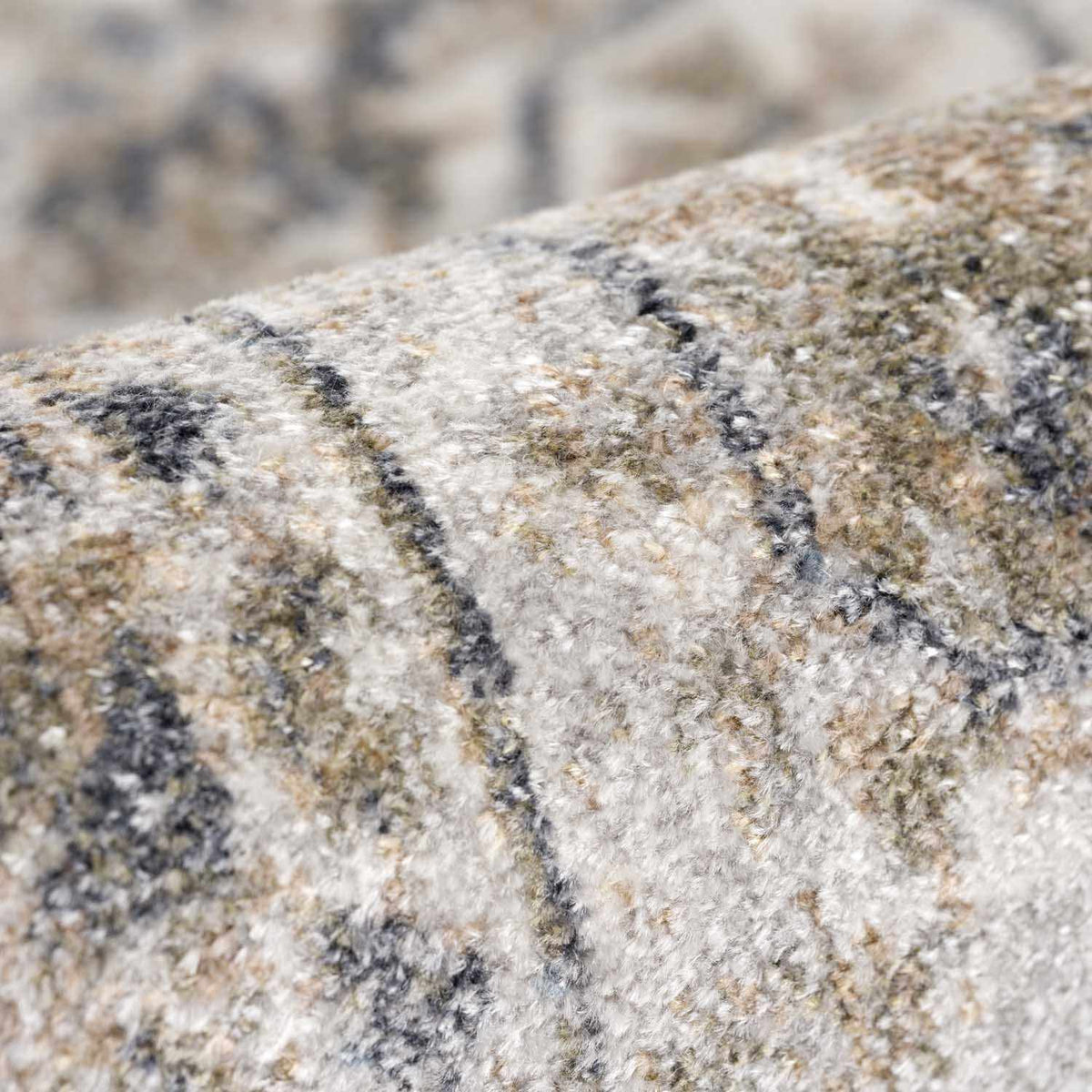 Rudo beige flat pile washable rug by Boutique Rugs, folded to show soft texture and neutral color for modern home decor.