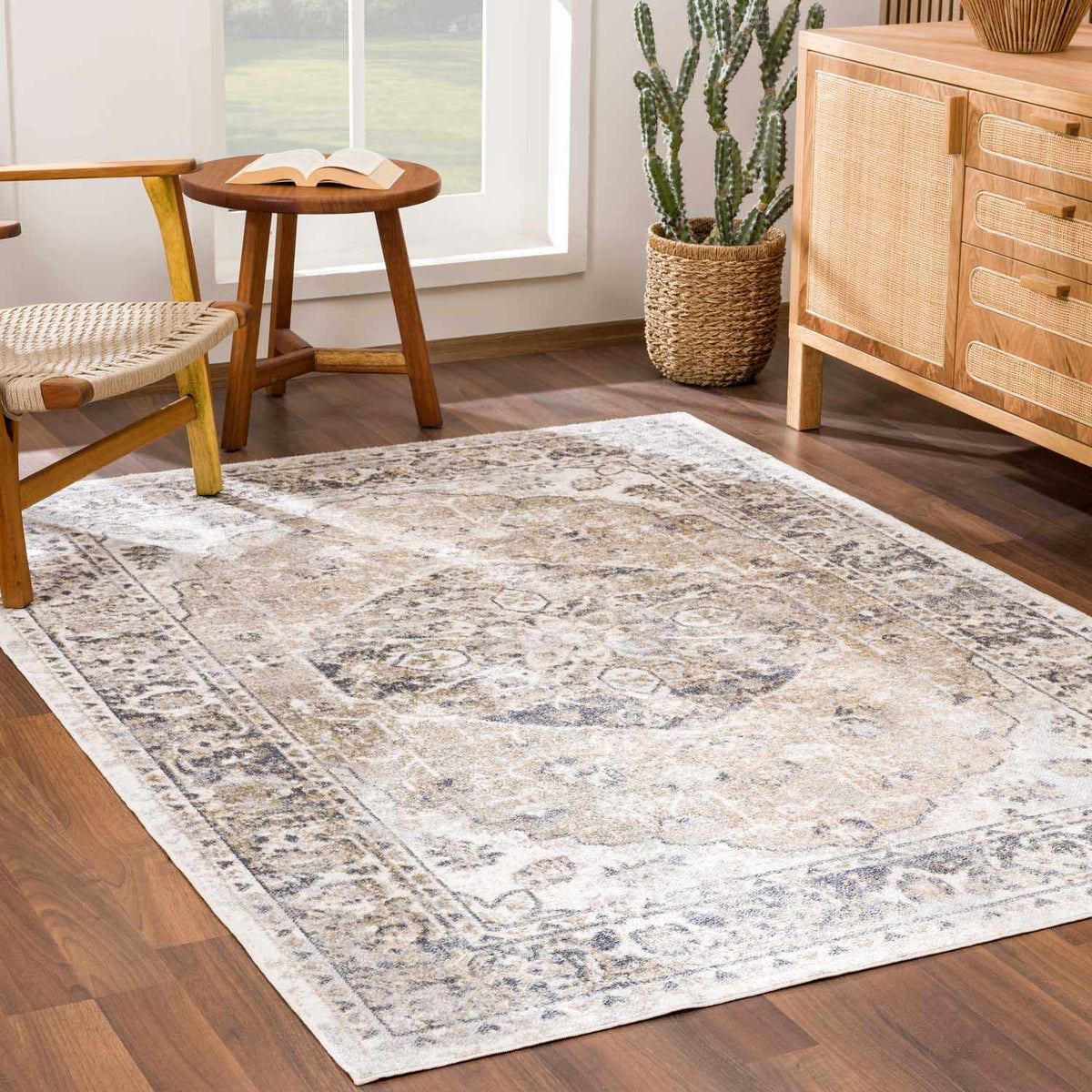 Beige Rudo flat pile washable rug by Boutique Rugs displayed in a cozy living room setting with furniture and decor.