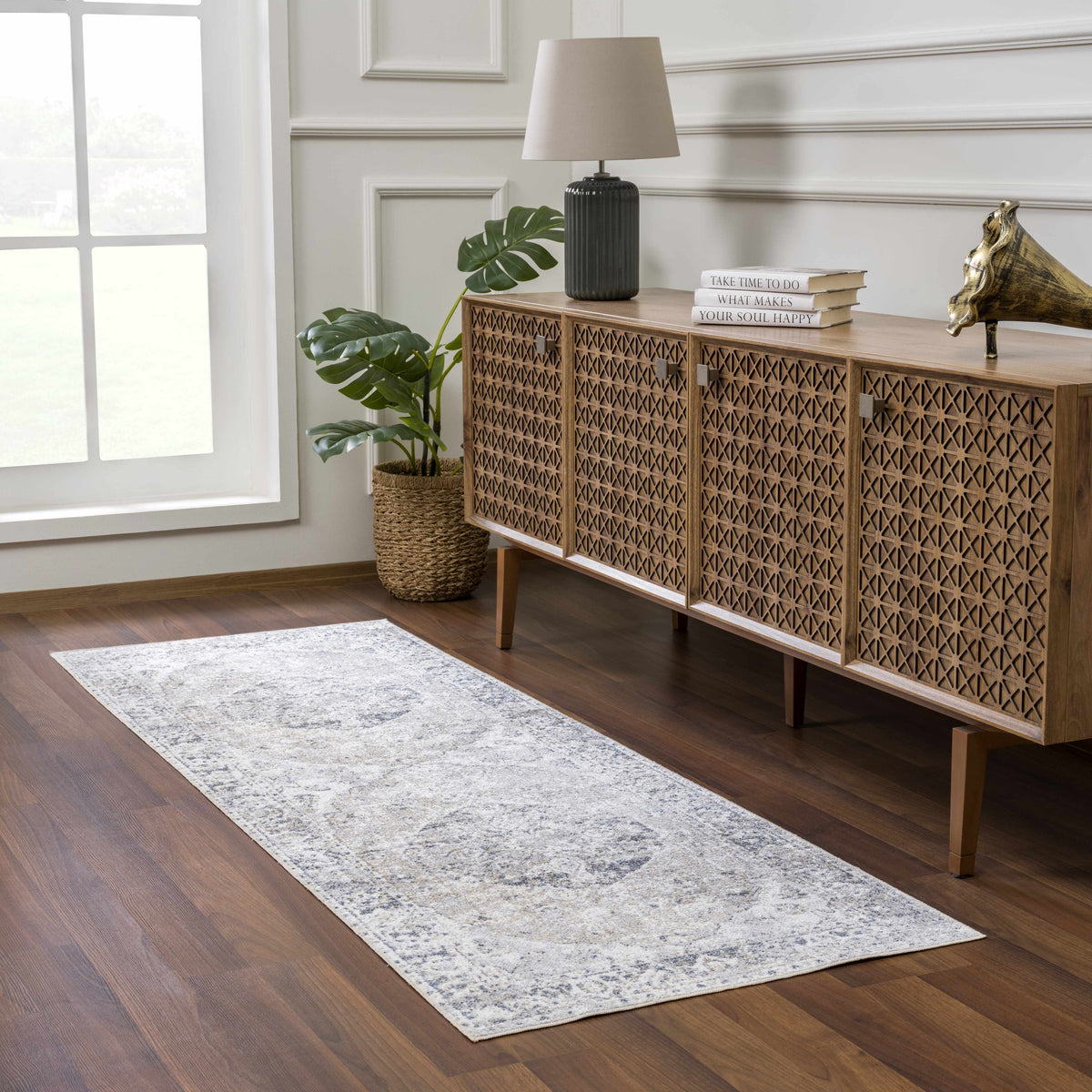 Rudo Flat Pile Washable Rug in a cozy living room scene, showcasing soft texture and neutral colors, by Boutique Rugs.