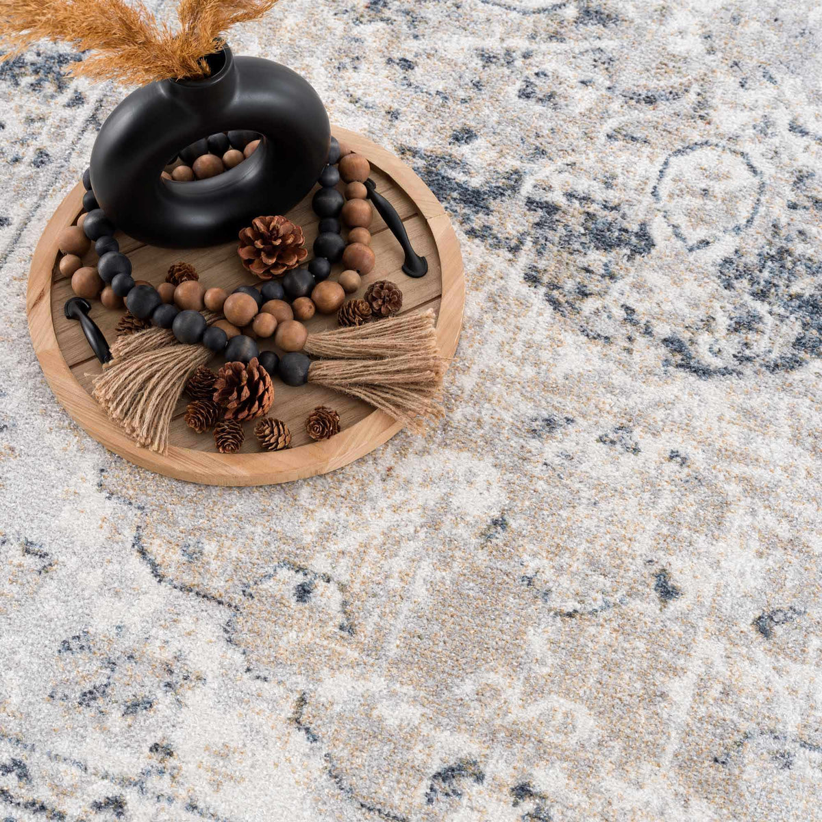 Boutique Rugs Rudo Flat Pile Washable Rug featuring a soft, textured design in neutral tones, displayed in a studio setting.