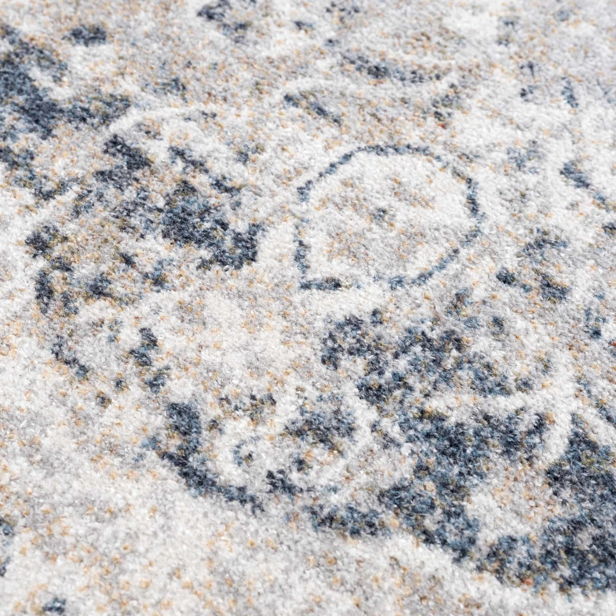 Close-up of the textured Rudo Flat Pile Washable Rug by Boutique Rugs, showcasing its soft, woven surface and neutral color.