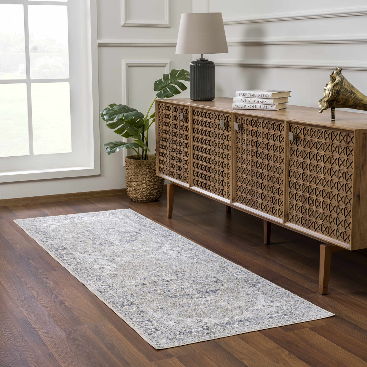 Rudoblu Boutique washable rug in a cozy room setting with neutral tones and intricate pattern, showcasing its soft texture and quality.