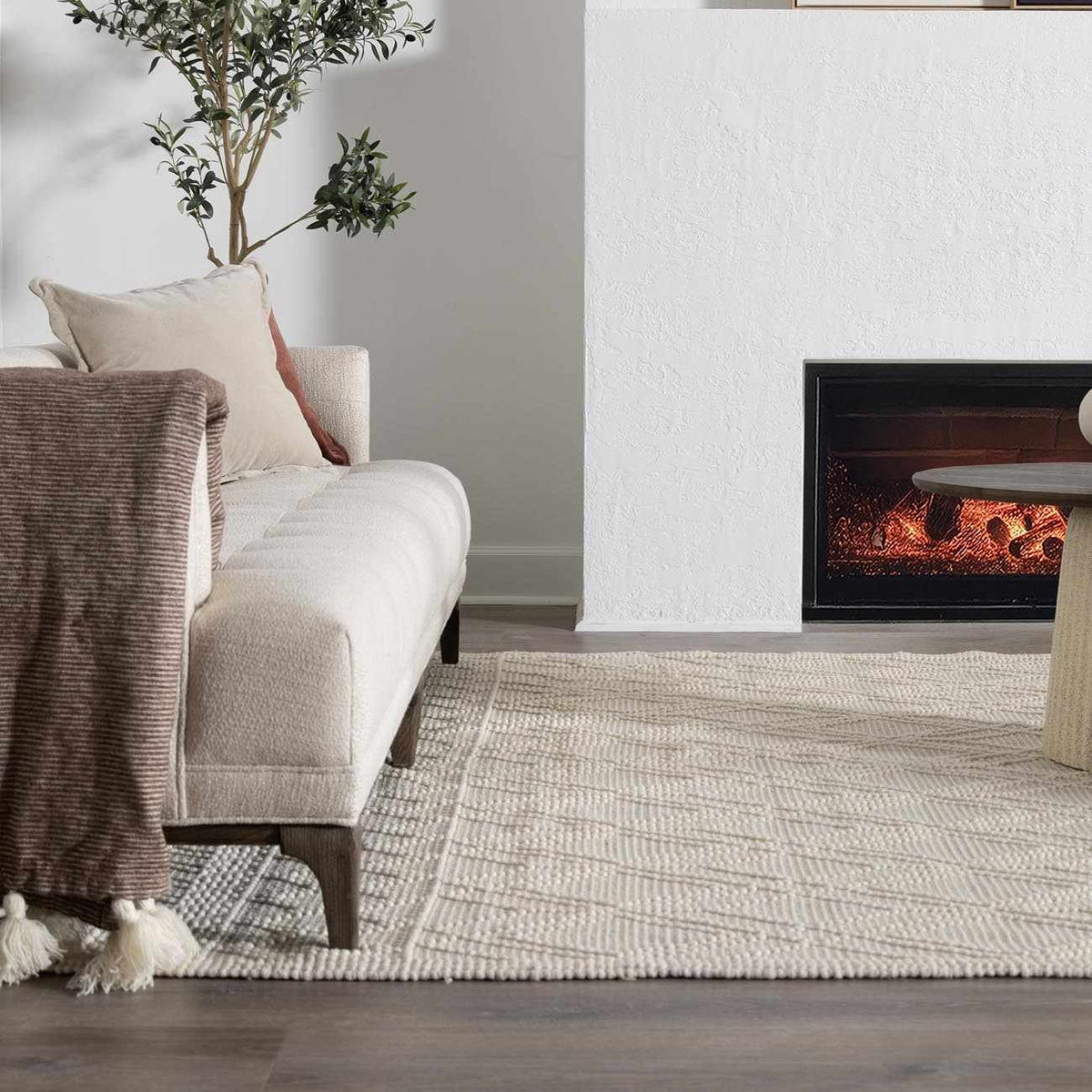 Ramsbury Beige Trellis Wool Rug from Boutique Rugs displayed in a living room setting with furniture and decor.
