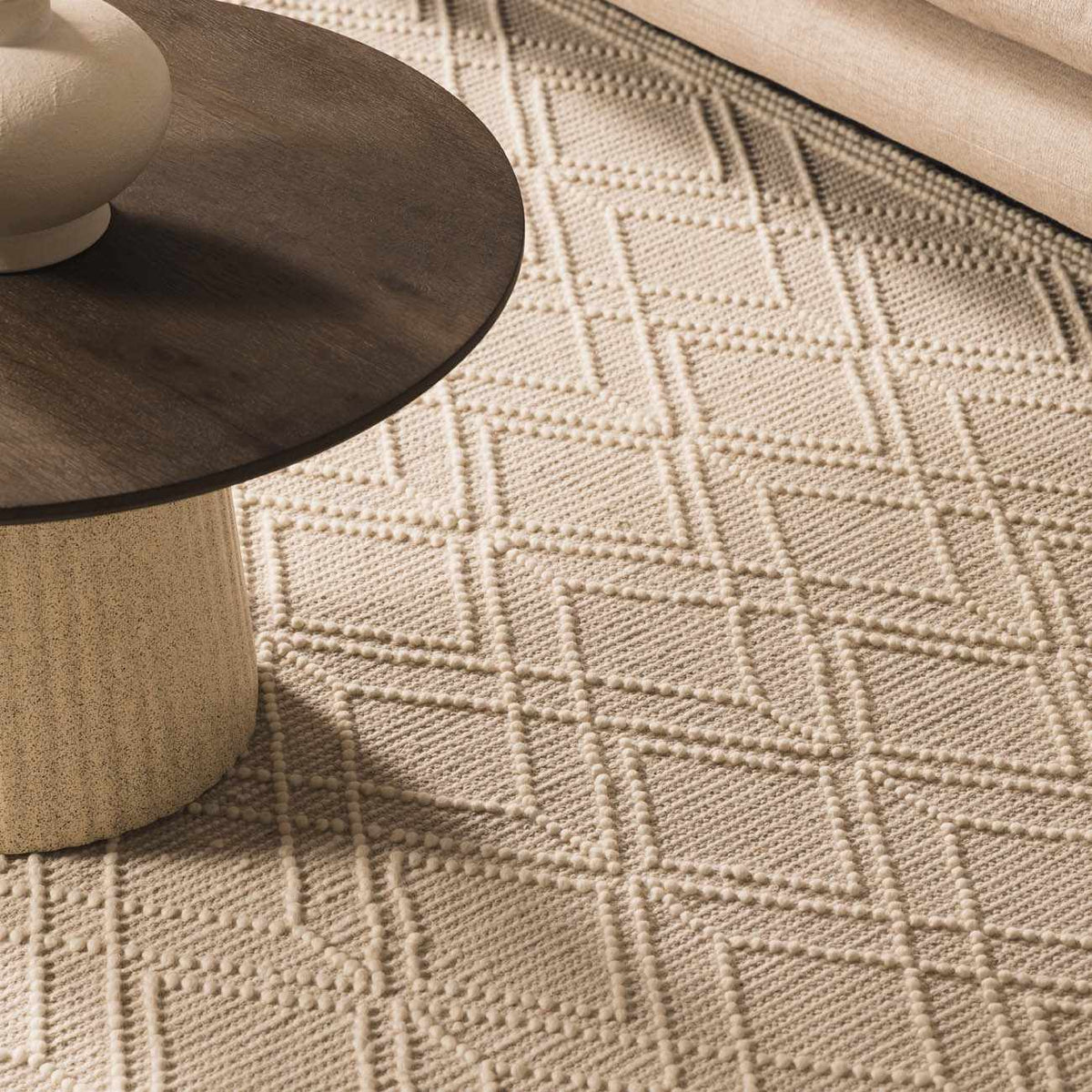 Beige trellis wool rug by Boutique Rugs in a cozy living room setting with furniture and decor.
