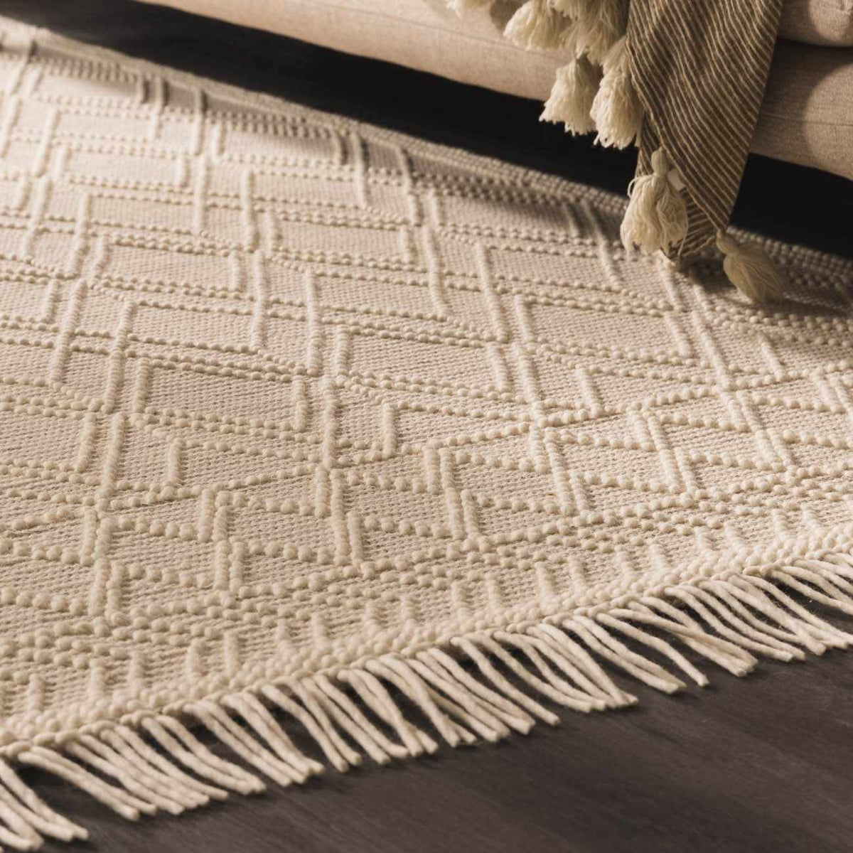 Ramsbury Beige Trellis Wool Rug by Boutique Rugs displayed in a living room setting with neutral tones and stylish decor.