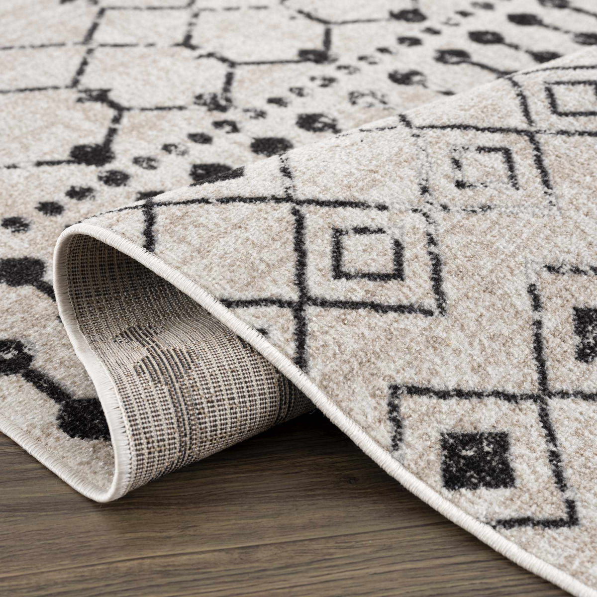 Folded Boutique Rugs Joppatowne washable area rug featuring a colorful geometric pattern for modern home decor.
