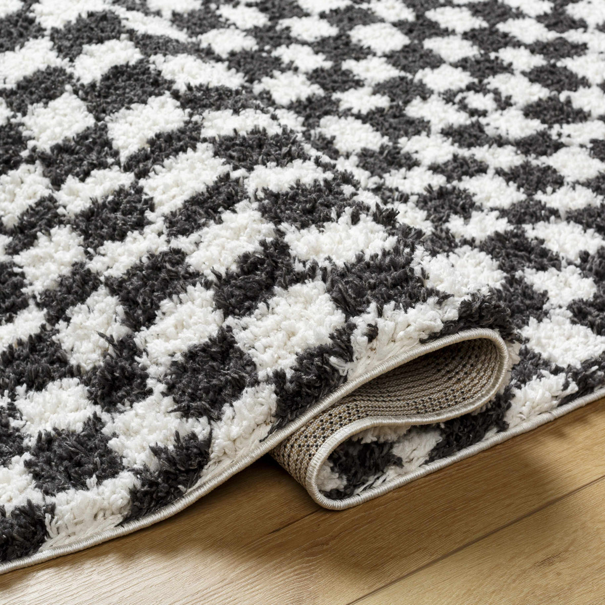 Black and white checkered shag rug by Boutique Rugs, featuring a soft, plush texture and modern geometric pattern.
