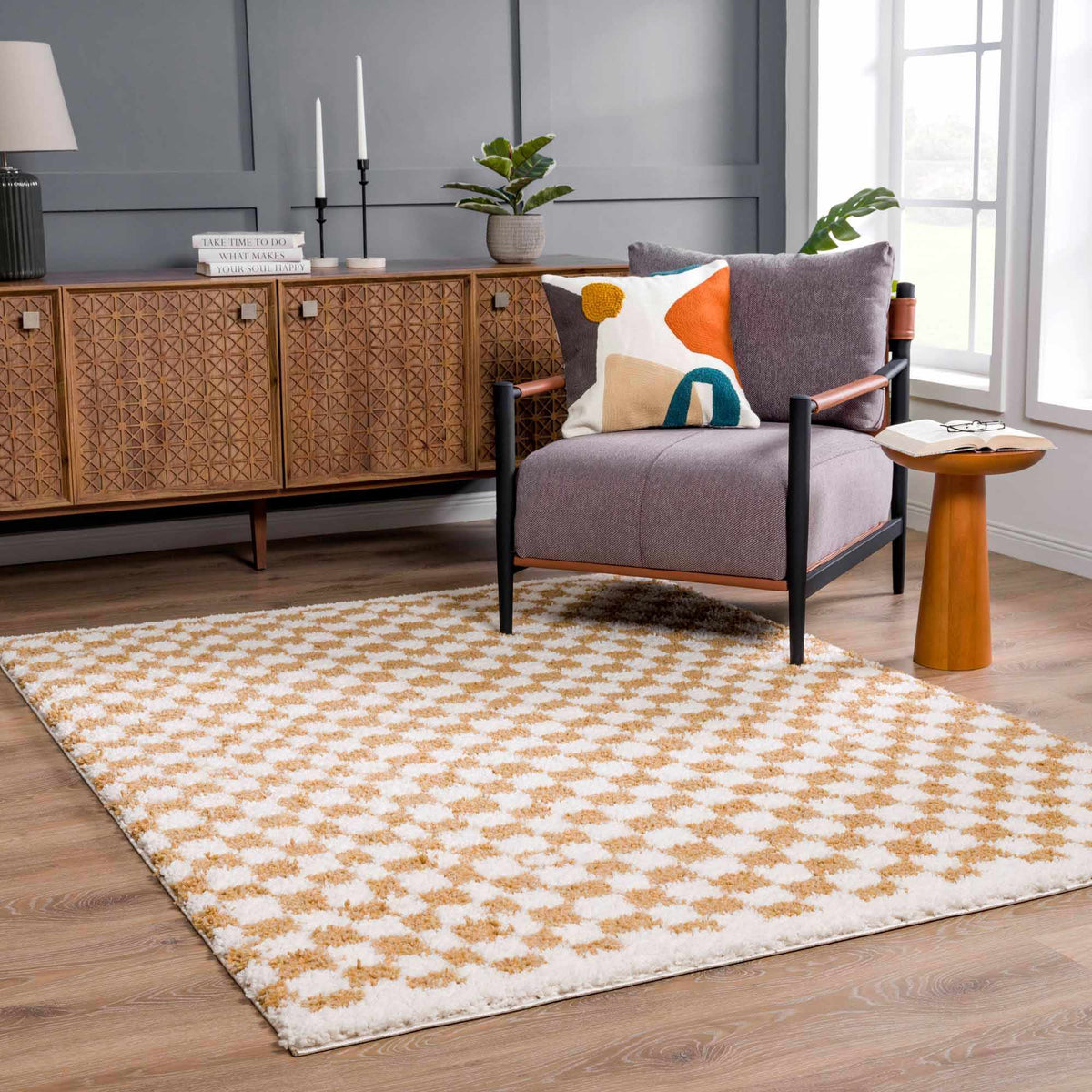 Kieu mustard and ivory checkered area rug by Boutique Rugs, showcasing a stylish, cozy living room with the rug on the floor.