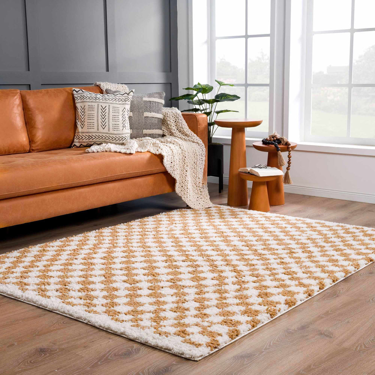 Kieu Mustard and Ivory Checkered Area Rug by Boutique Rugs, showing a cozy room scene with the rug on the floor.