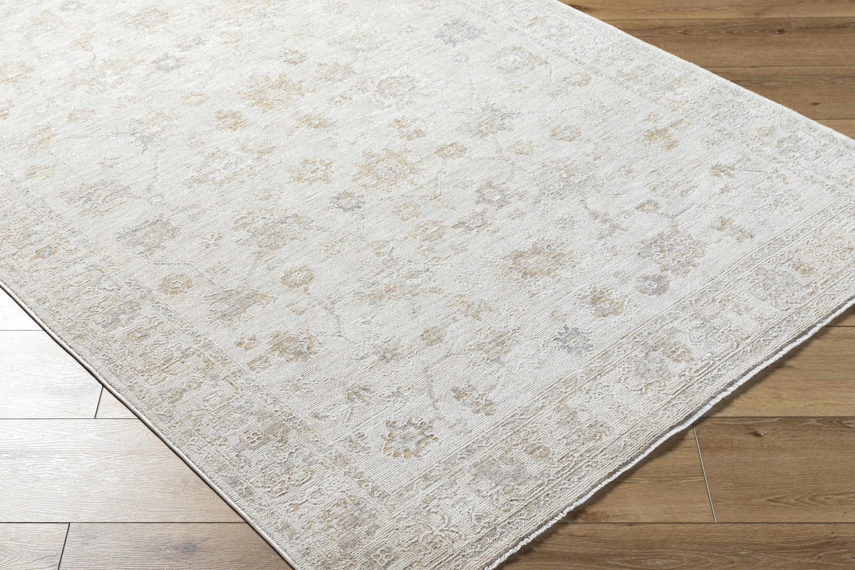 Corner view of Boutique Rugs Sashi Ivory Luxe area rug, showcasing its elegant design and soft texture.