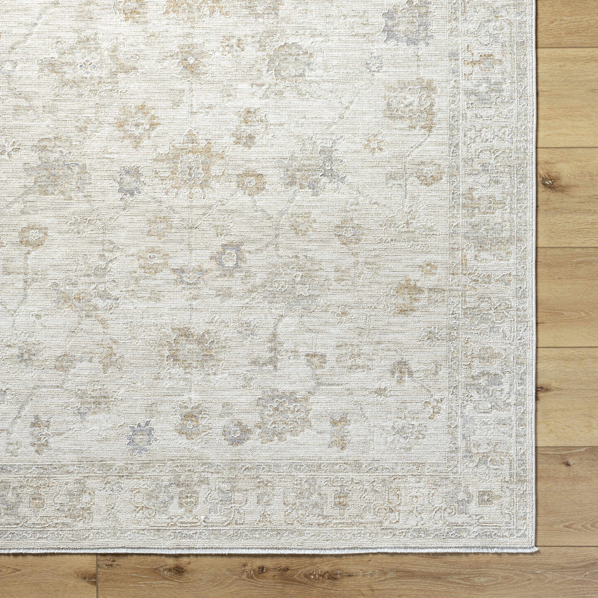 Overhead view of Sashi Ivory Luxe area rug by Boutique Rugs, showcasing its elegant pattern and soft textured surface.