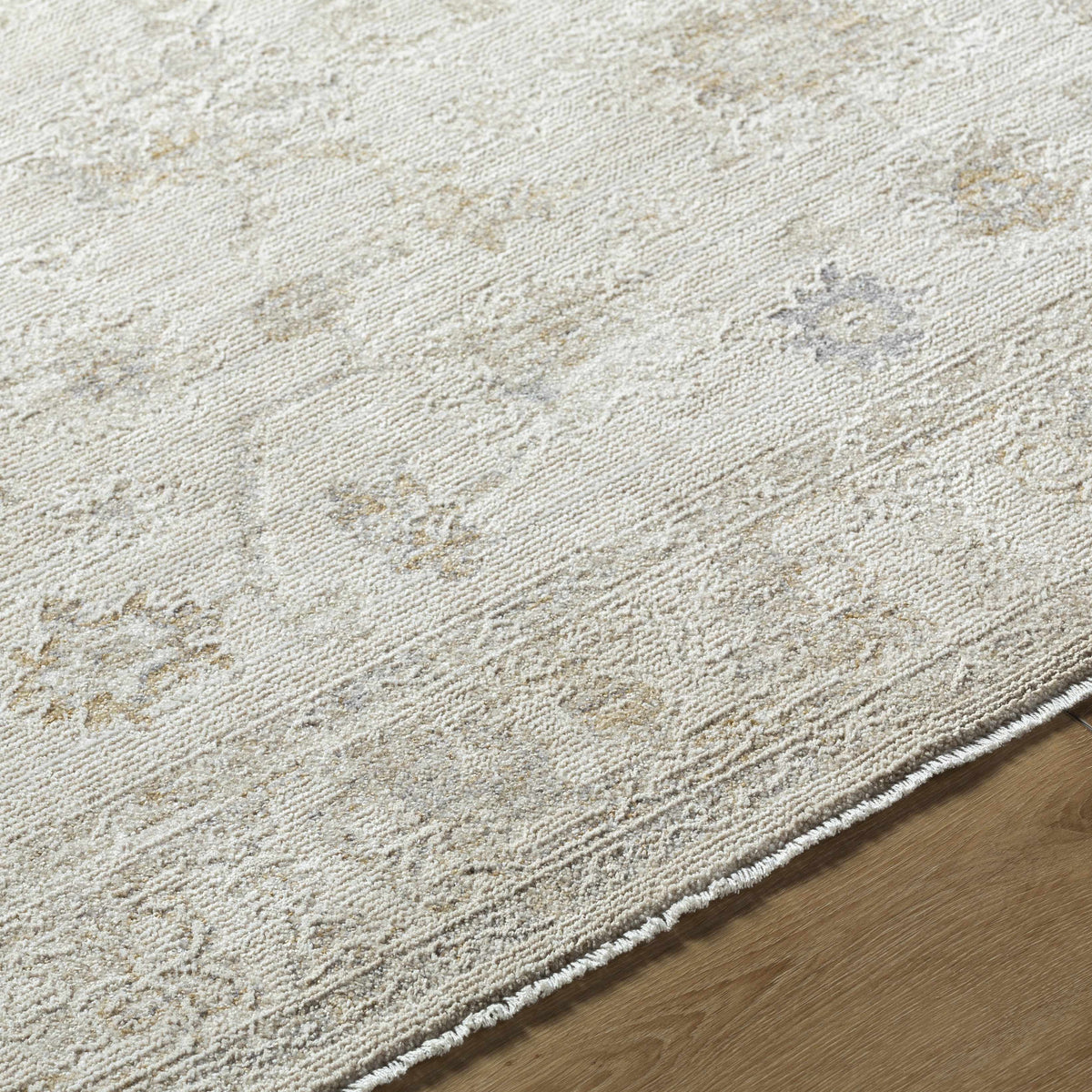 Close-up of the Sashi Ivory Luxe Area Rug by Boutique Rugs showcasing its soft, textured ivory design and plush surface.
