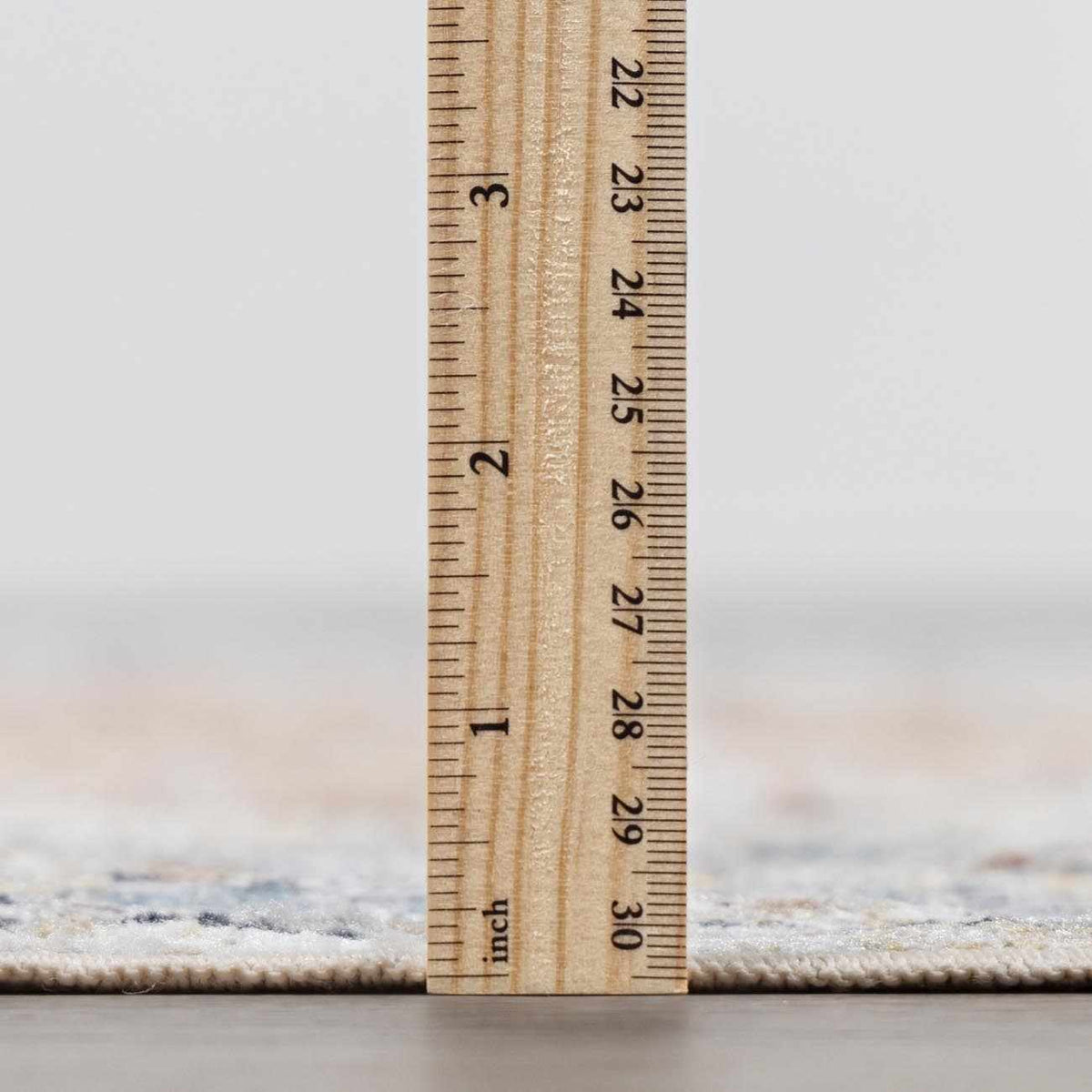 Boutique Rugs Emke flat pile washable rug in neutral tones, close-up showing soft, textured surface and durable fabric.