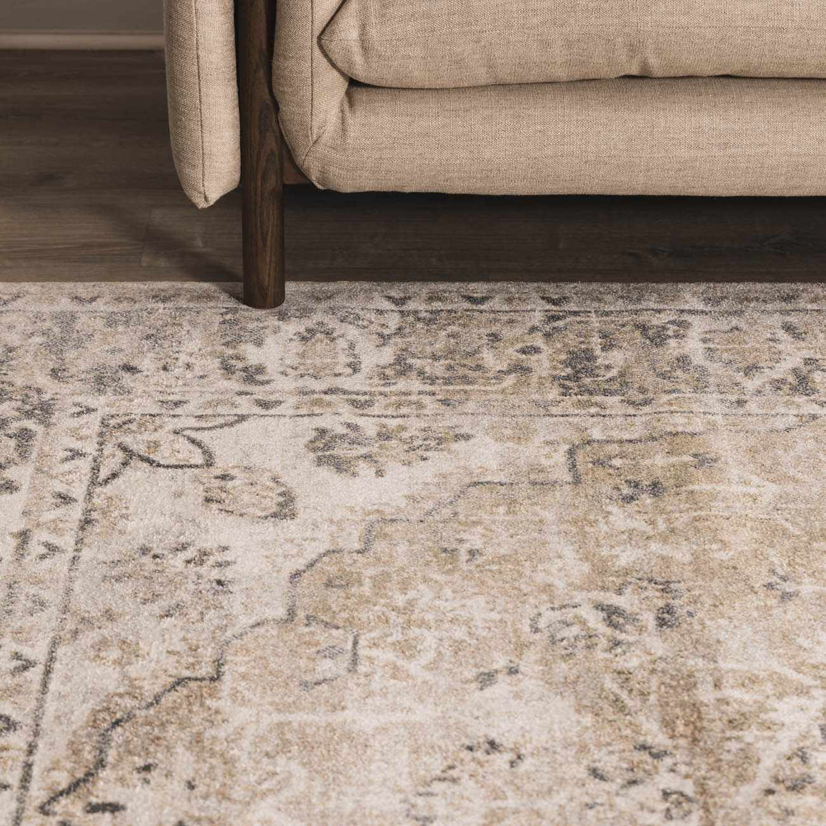 Beige flat pile washable rug by Boutique Rugs displayed in a cozy room setting with furniture and decor.