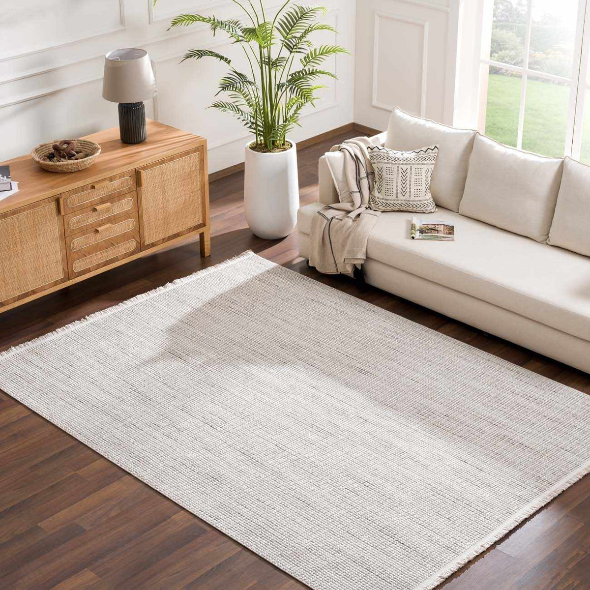 Gowan Cream area rug by Boutique Rugs, soft and plush with a subtle cream color, displayed in a modern living room setup.