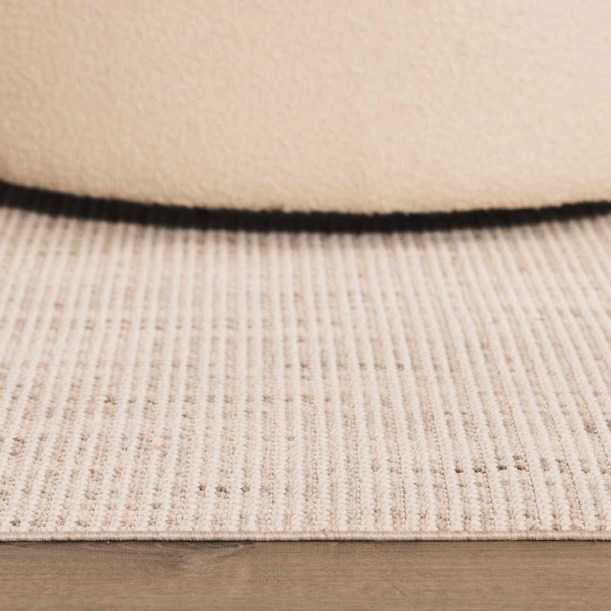 Cream Gowan area rug by Boutique Rugs, shown in a room scene with cozy, stylish decor and plush texture.