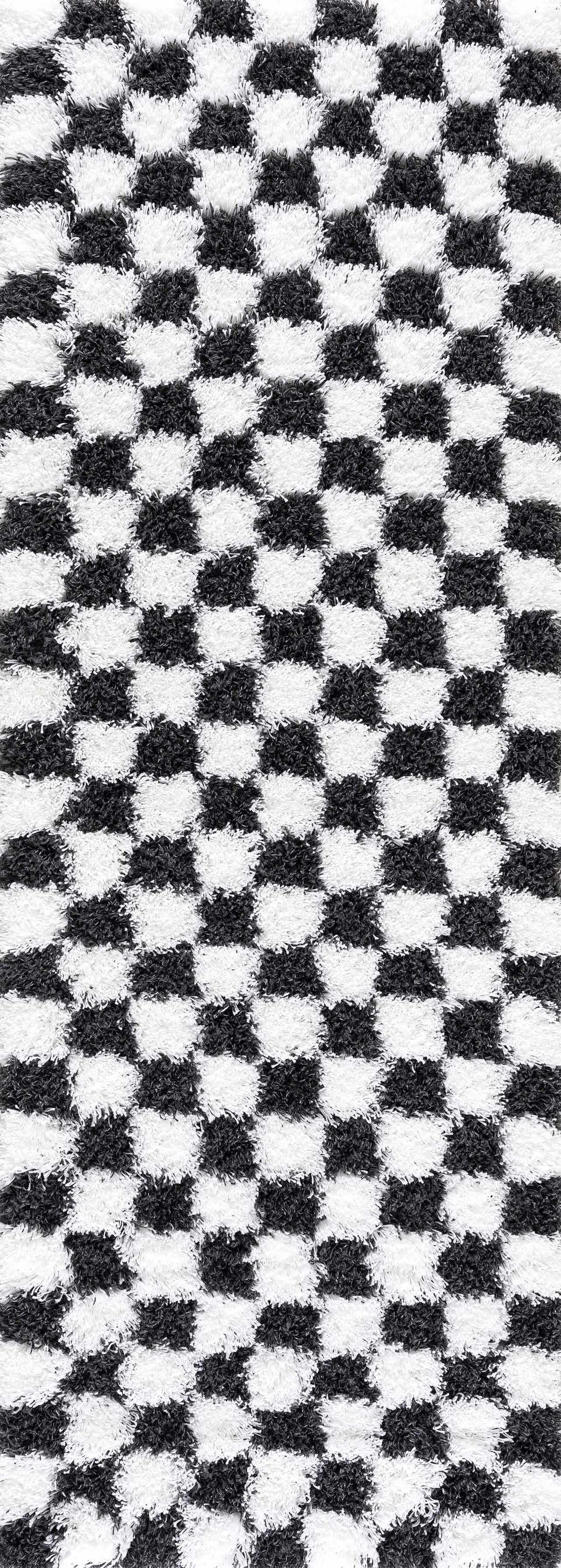 Black and white checkered area rug by Boutique Rugs, featuring a modern geometric pattern, perfect for contemporary living spaces.