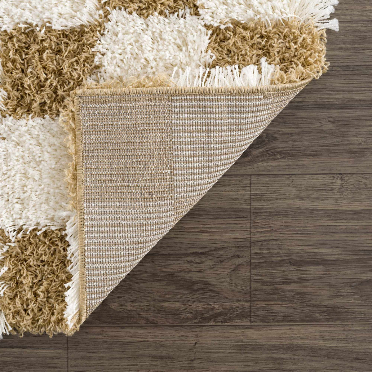 Atira Mustard Checkered Area Rug by Boutique Rugs, folded to show its vibrant mustard and black checkered pattern.