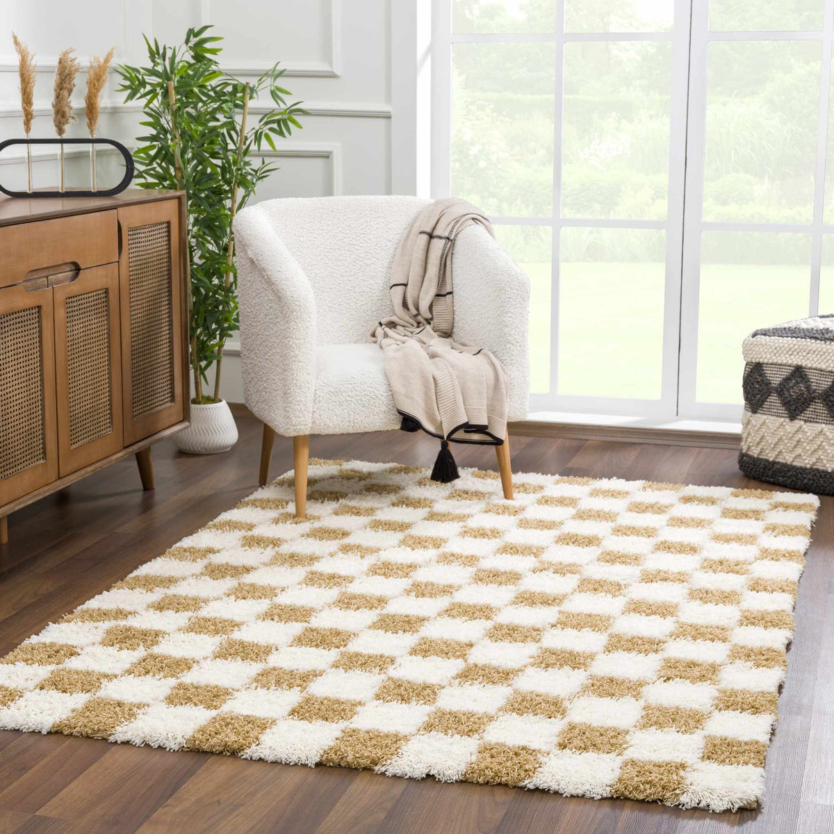 Atira mustard checkered area rug by Boutique Rugs in a living room setting, showcasing its bold pattern and cozy texture.