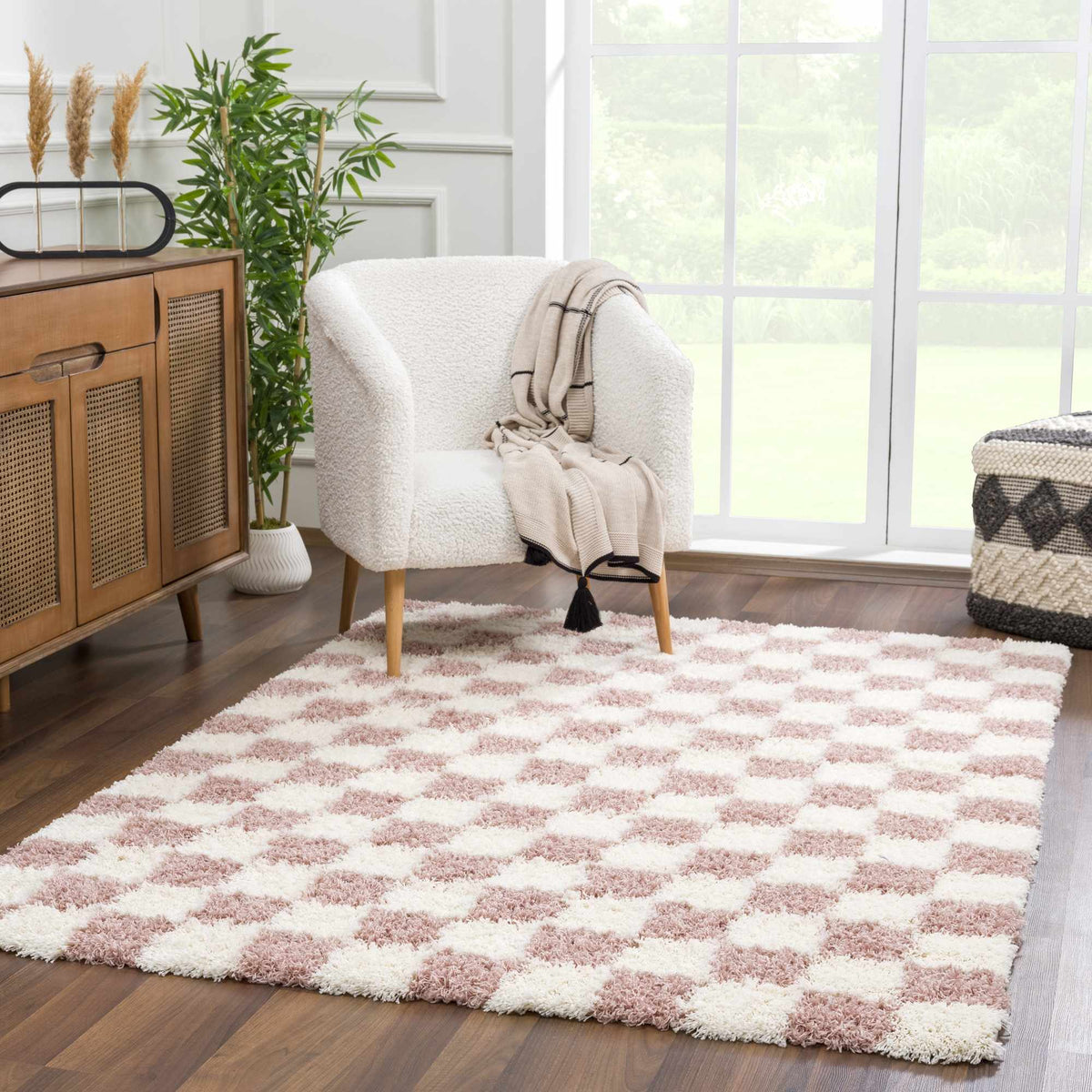 Pink checkered shag rug from Boutique Rugs in a room scene, showcasing soft texture and vibrant pattern for cozy home decor.