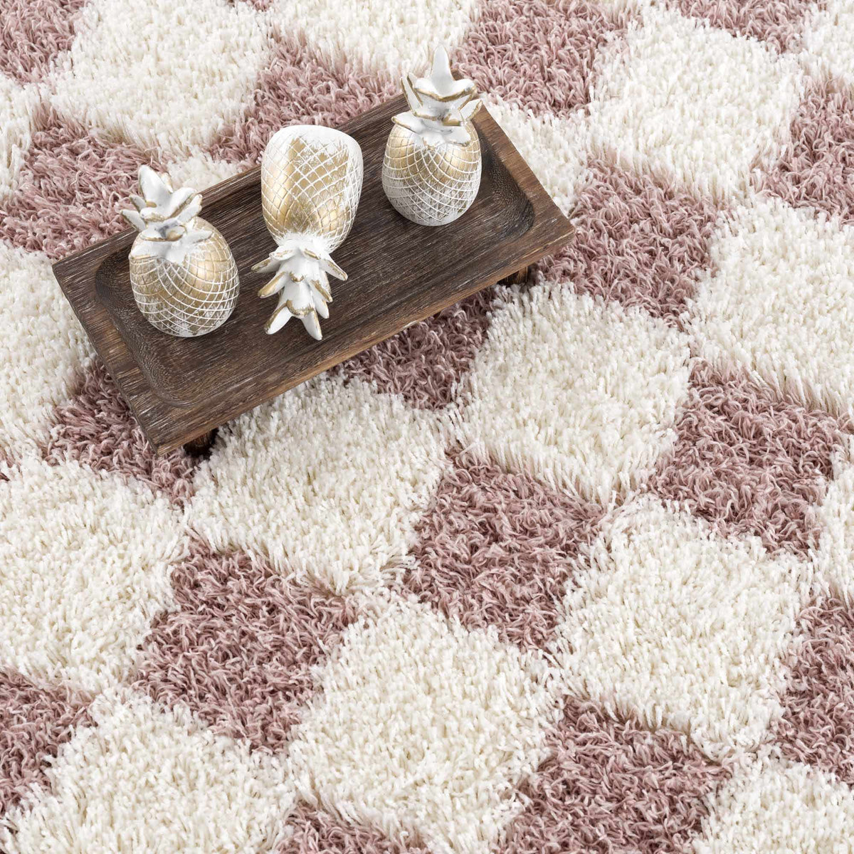 Pink checkered shag rug by Boutique Rugs, showcasing a cozy, plush texture and vibrant pattern in a stylish interior setting.