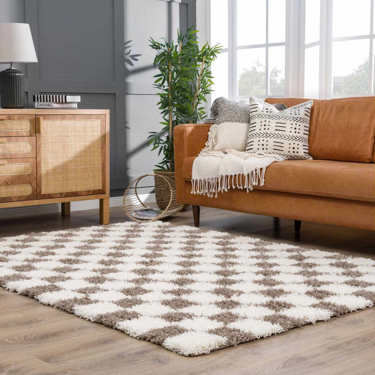 Brown checkered Boutique Rugs area rug displayed in a room scene, showcasing its stylish checkered pattern and cozy texture.