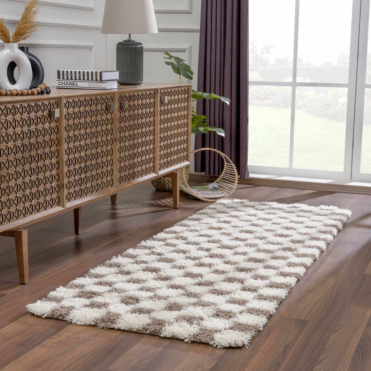 Brown checkered Boutique Rugs area rug displayed in a living room scene with furniture and decor.